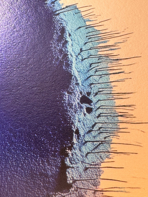 IMPACT 0016, close crop of the ragged edge where deep indigo blue meets a pale turquoise band, both fraying into thin blue-black threads against warm gold paper.
