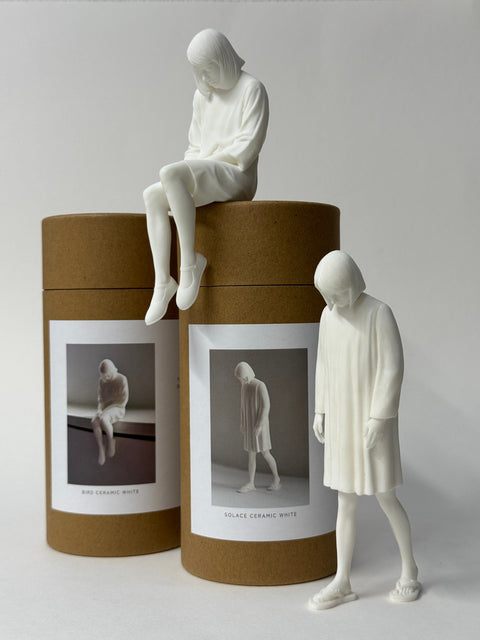 Bird and Solace by Kalle Hellzén with their paper tube packaging