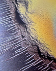 IMPACT 0016, extreme close-up of the disc's ragged rim showing fine dark thread-like fringe over textured paper, next to a solid yellow field beyond the torn edge.