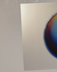 Phone lock screen showing three IMPACT works by Kalle Hellzen on the atelier work table as wallpaper.