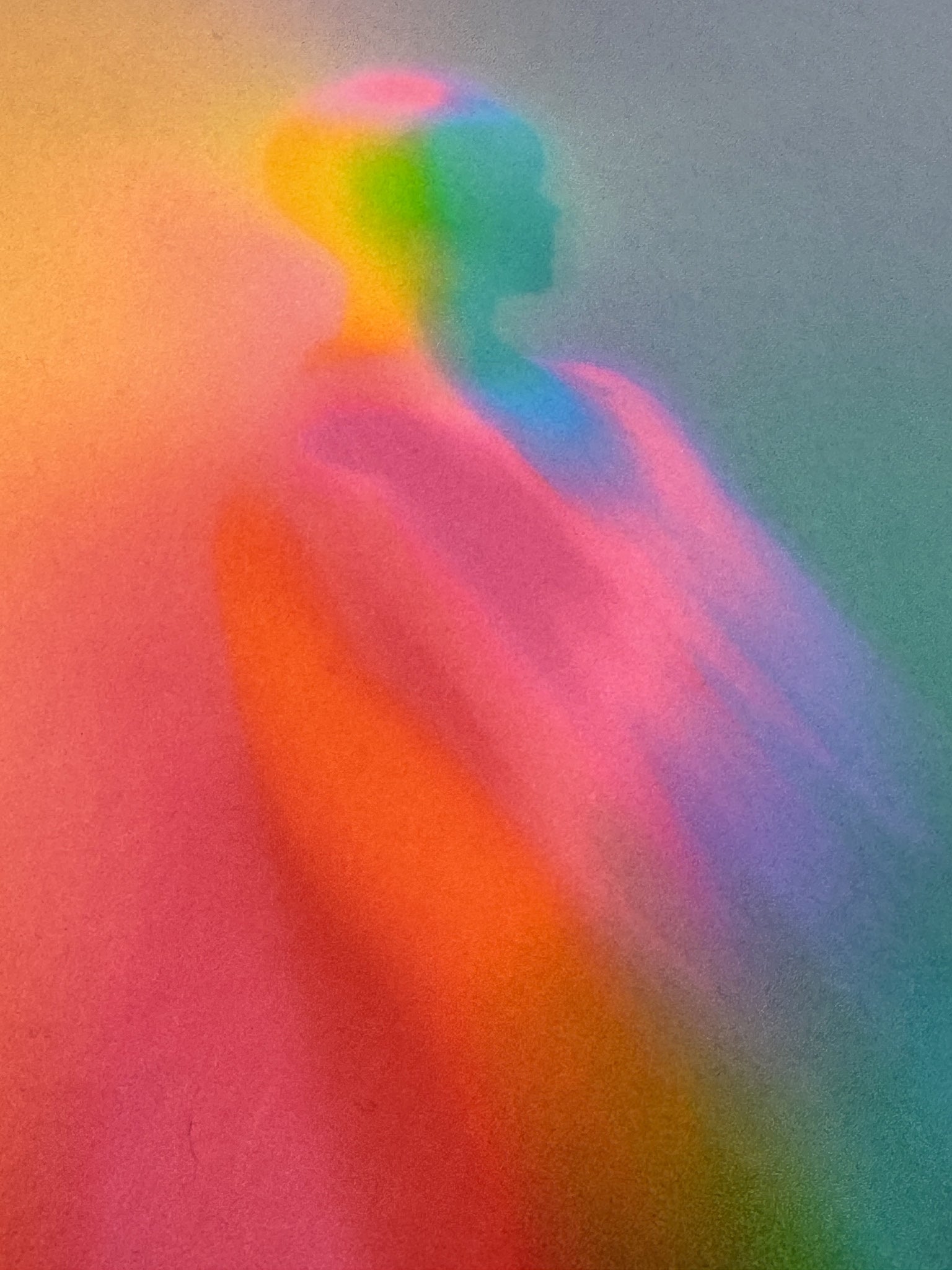 Close detail of What Comes Back by Atelier Kalle Hellzén, hand-signed and numbered Limited Edition of 5. The upper figure seen near full bleed, colour shifting from orange and pink to green and blue across the body, the paper fibre legible through the pigment. Giclée on handmade kozo washi.