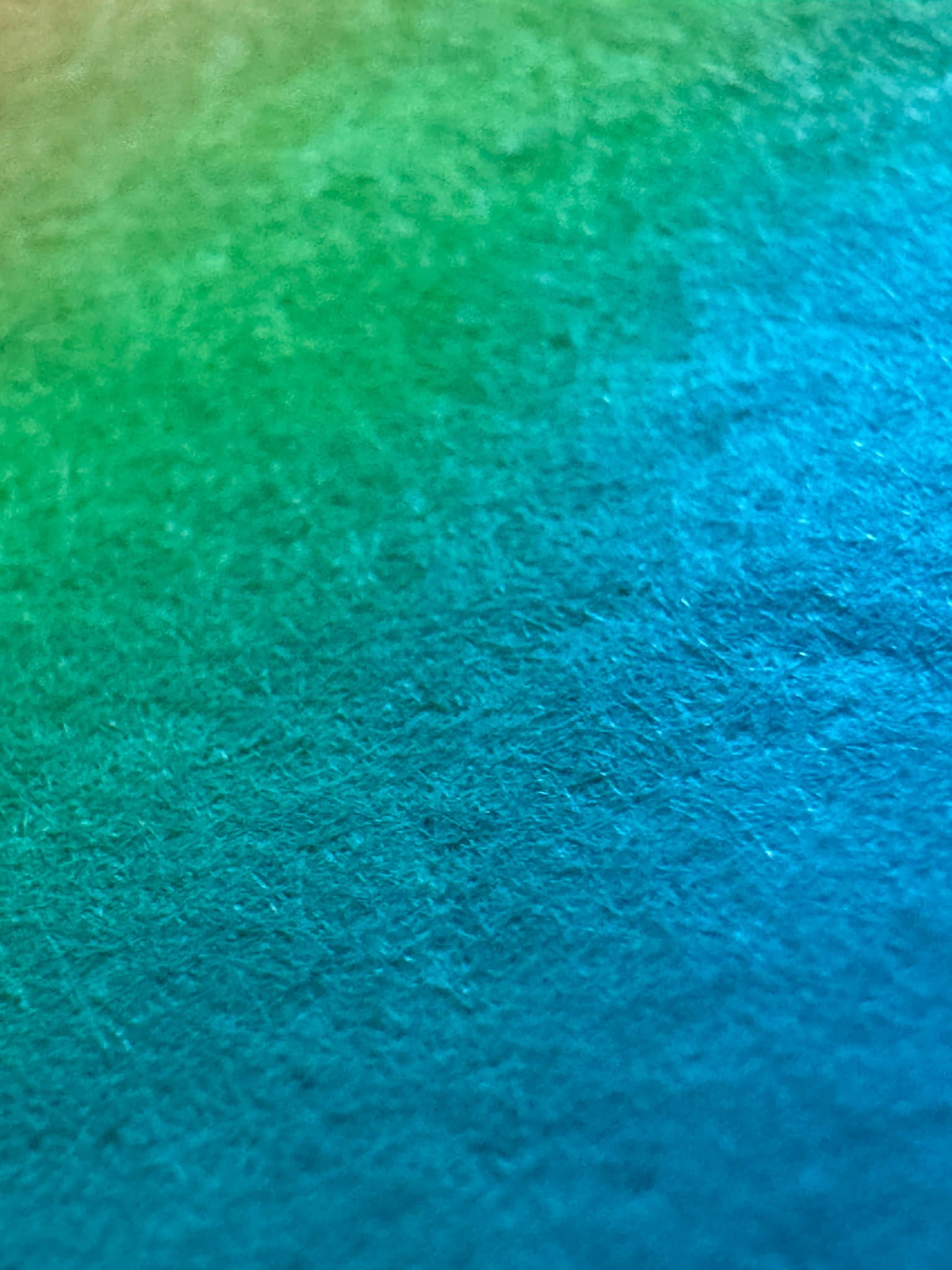 Surface detail of What Comes Back by Atelier Kalle Hellzén, the pigment reading as bands of orange, pink and teal across the visible fibre of the handmade sheet, with no figure in frame. Giclée on handmade kozo washi.