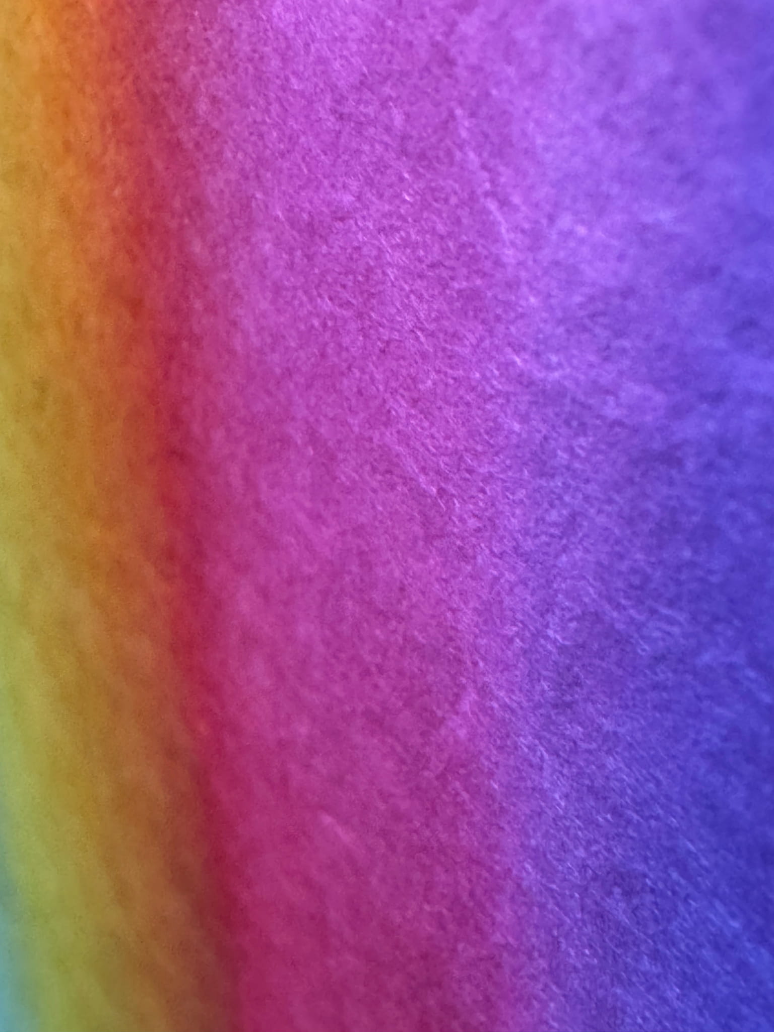 Surface detail of What Comes Back by Atelier Kalle Hellzén showing the matte kozo washi grain, colour shifting from warm orange through green to teal across the sheet. Giclée on handmade kozo washi.